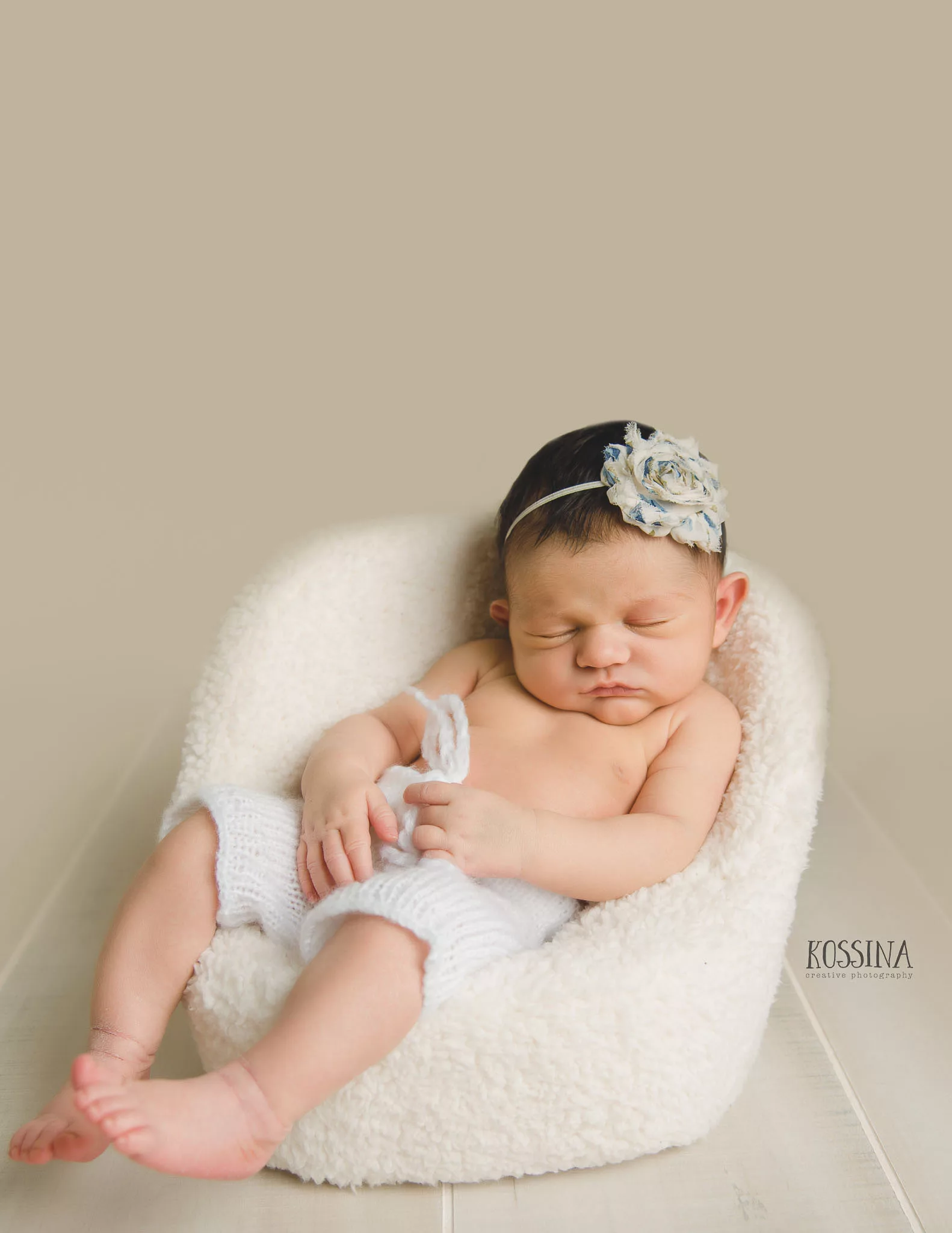 newborn girl posing pod