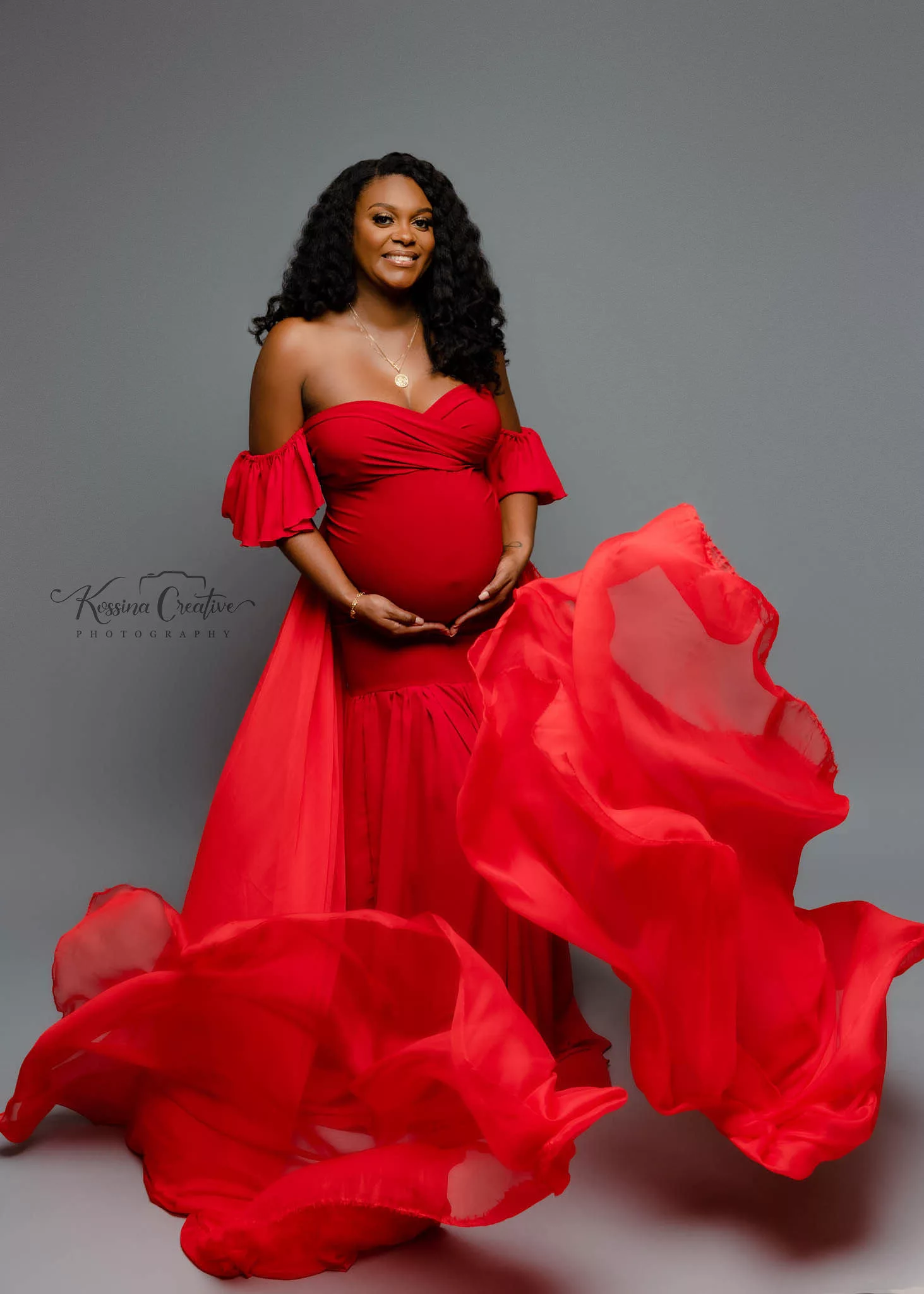 Orlando Maternity Photographer Photo Studio red flowy with grey background