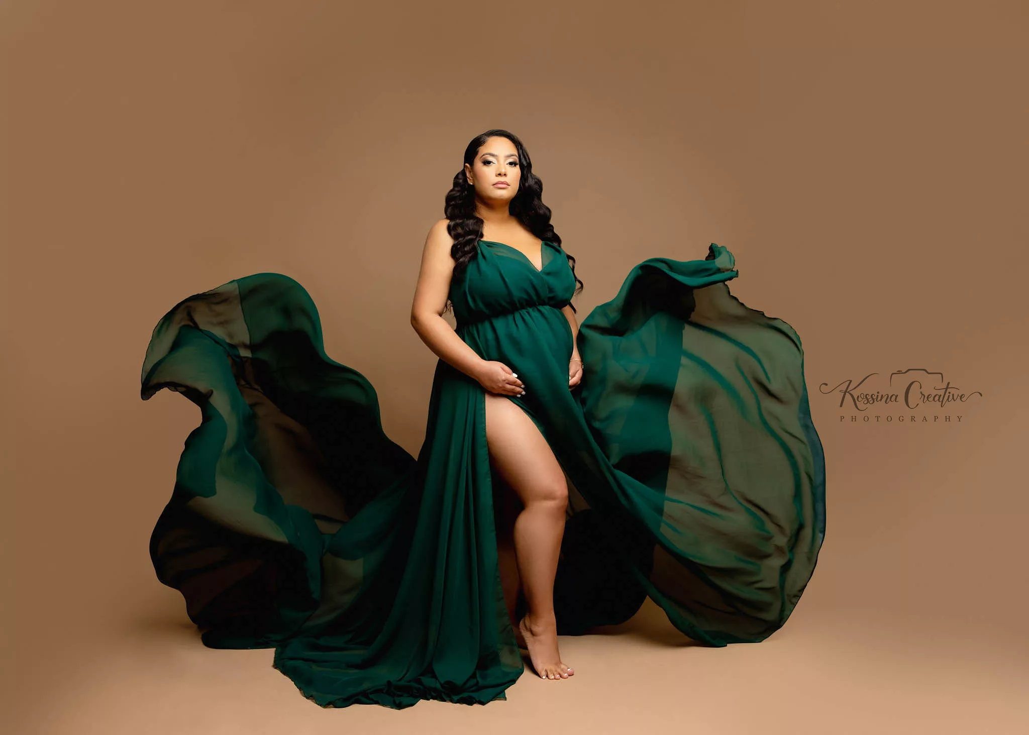 Orlando Maternity Photographer Photo Studio green gown flowy dress with brow background