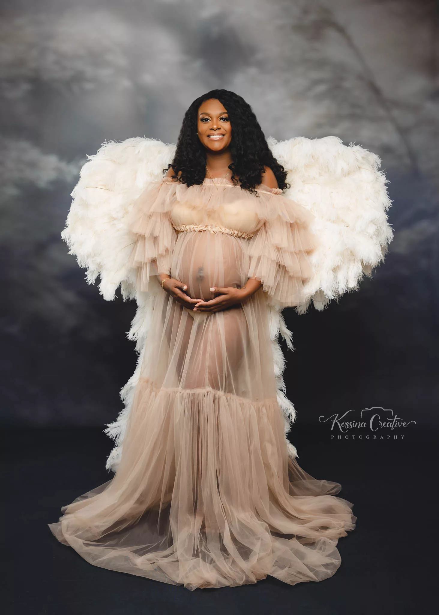 Orlando Maternity Photographer Photo Studio maternity wings photo shoot grey background
