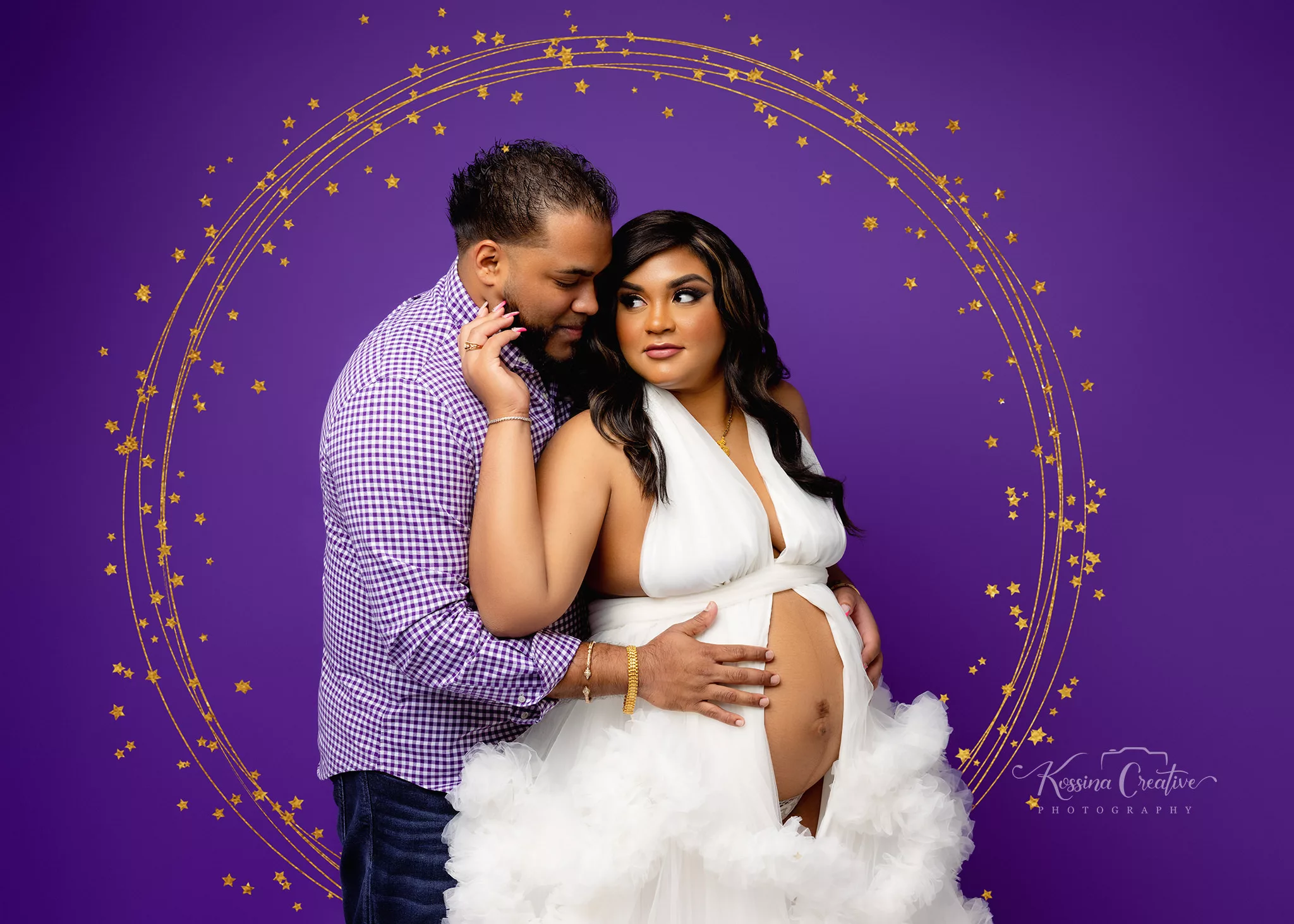 Orlando Maternity Photographer Photo Studio couples maternity with stars and purple background