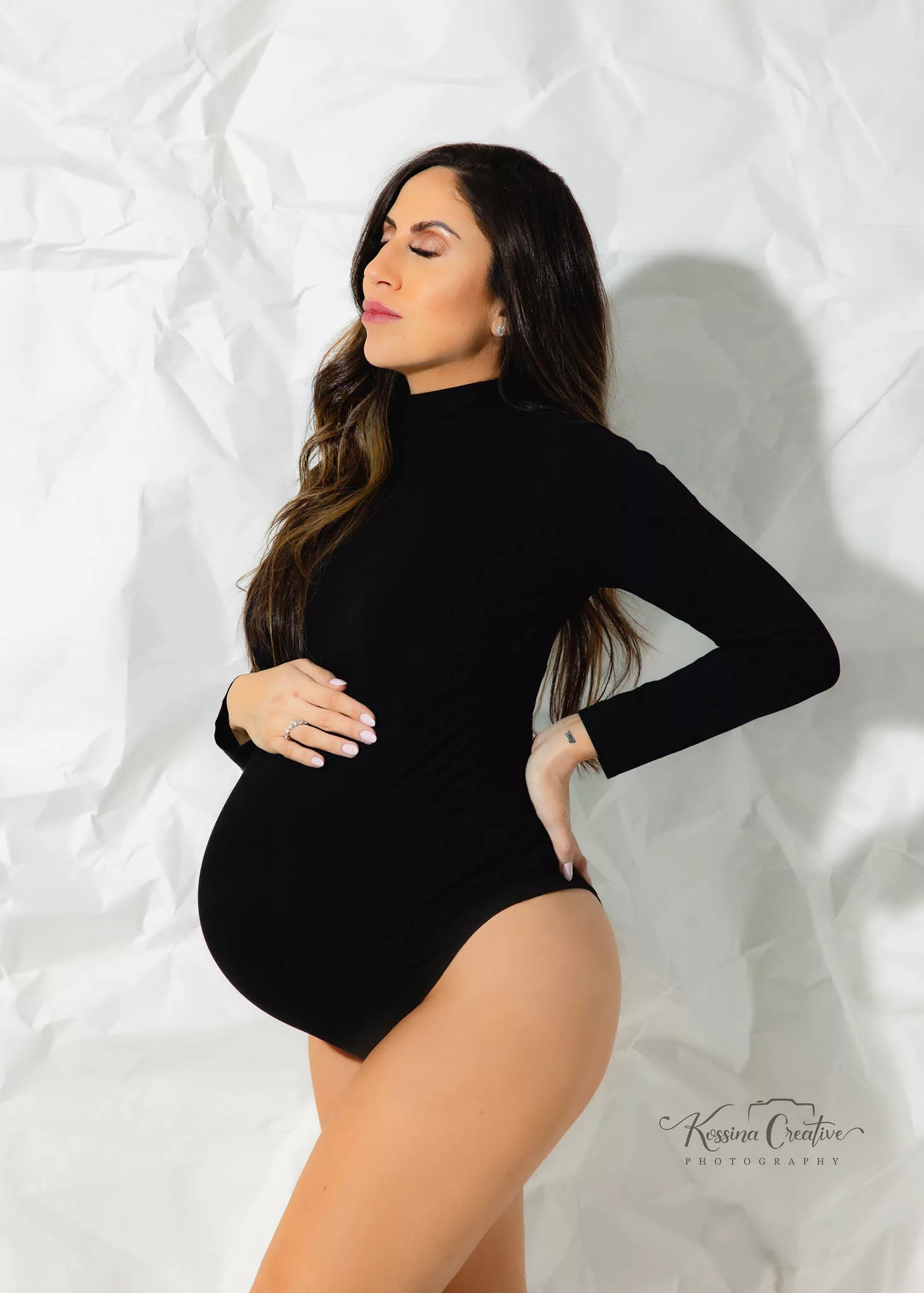 Orlando Maternity Photographer Photo Studio maternity silhouette with white background and black one piece