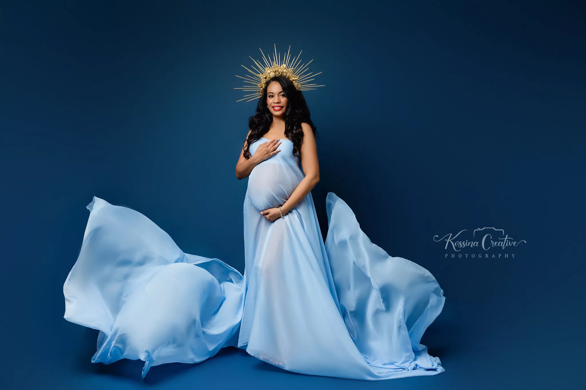 Orlando Maternity Photographer Photo Studio with blue background and gold crown