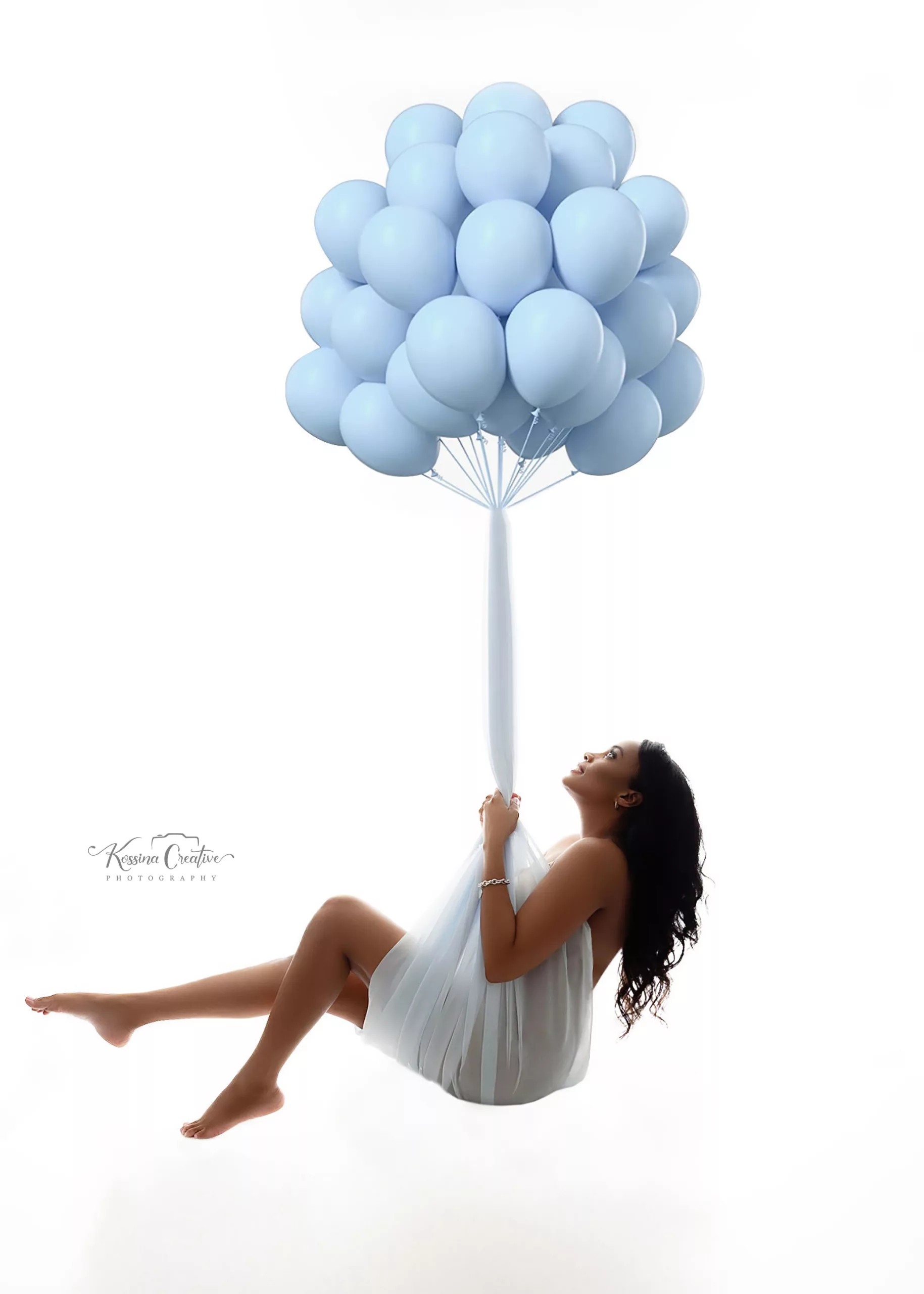 Orlando Maternity Photographer Photo Studio hanging balloons blue