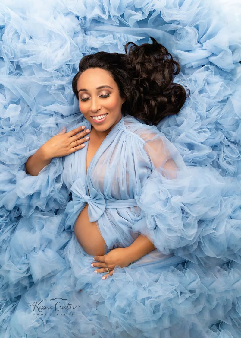 orlando maternity photographer studio laying down blue dress