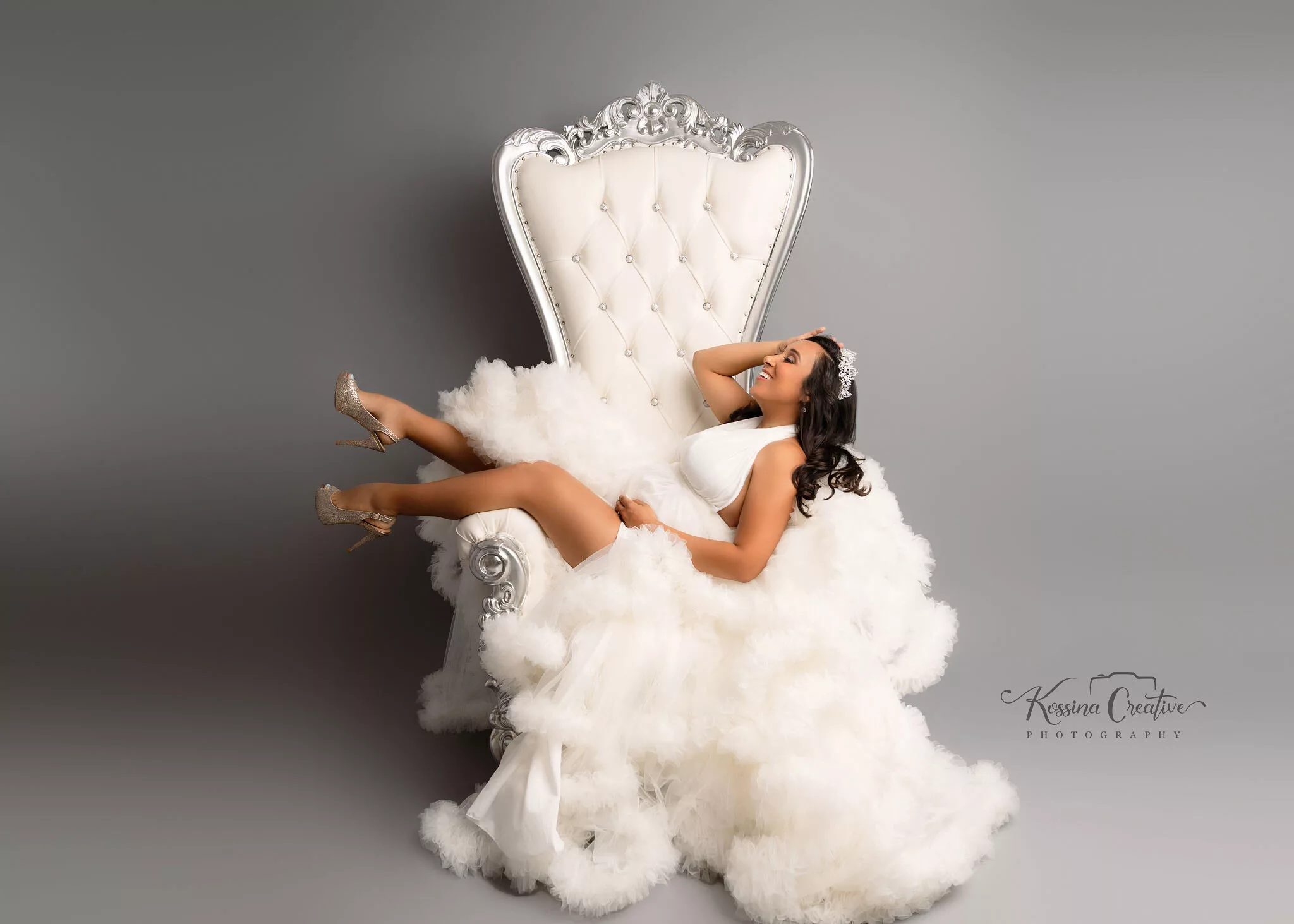 orlando maternity photographer studio thrown chair white fluffy dress