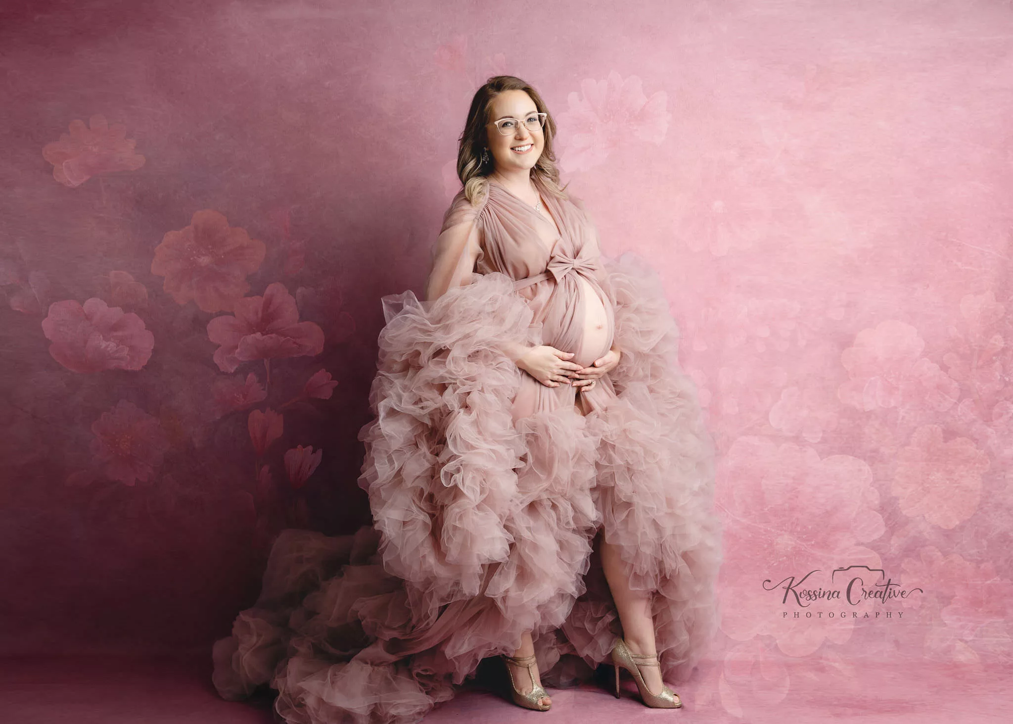 orlando maternity photographer studio thrown pink fluffy dress floral background