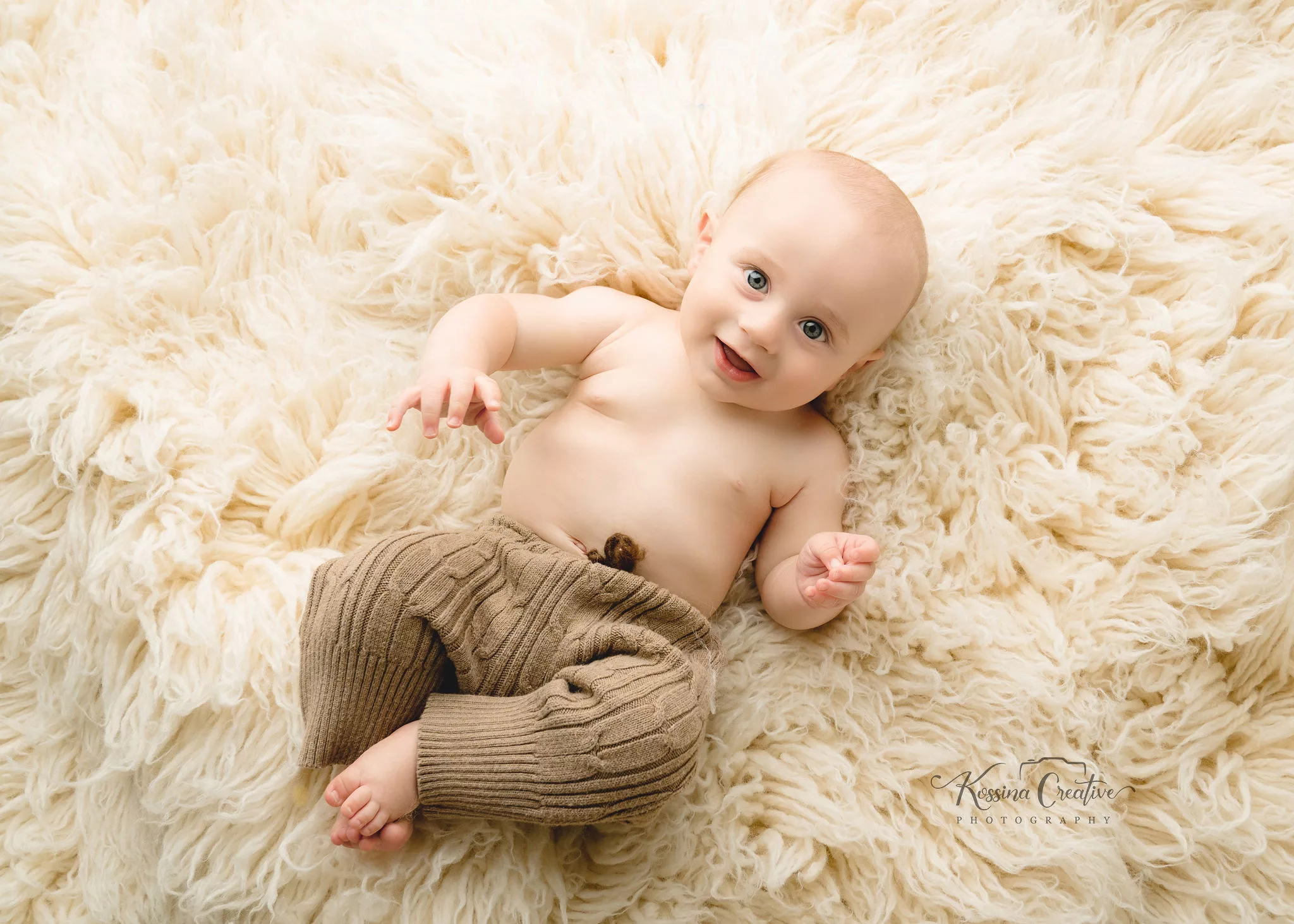 Orlando Baby Photographer 6 month sitter milestone baby boy on fluff cream