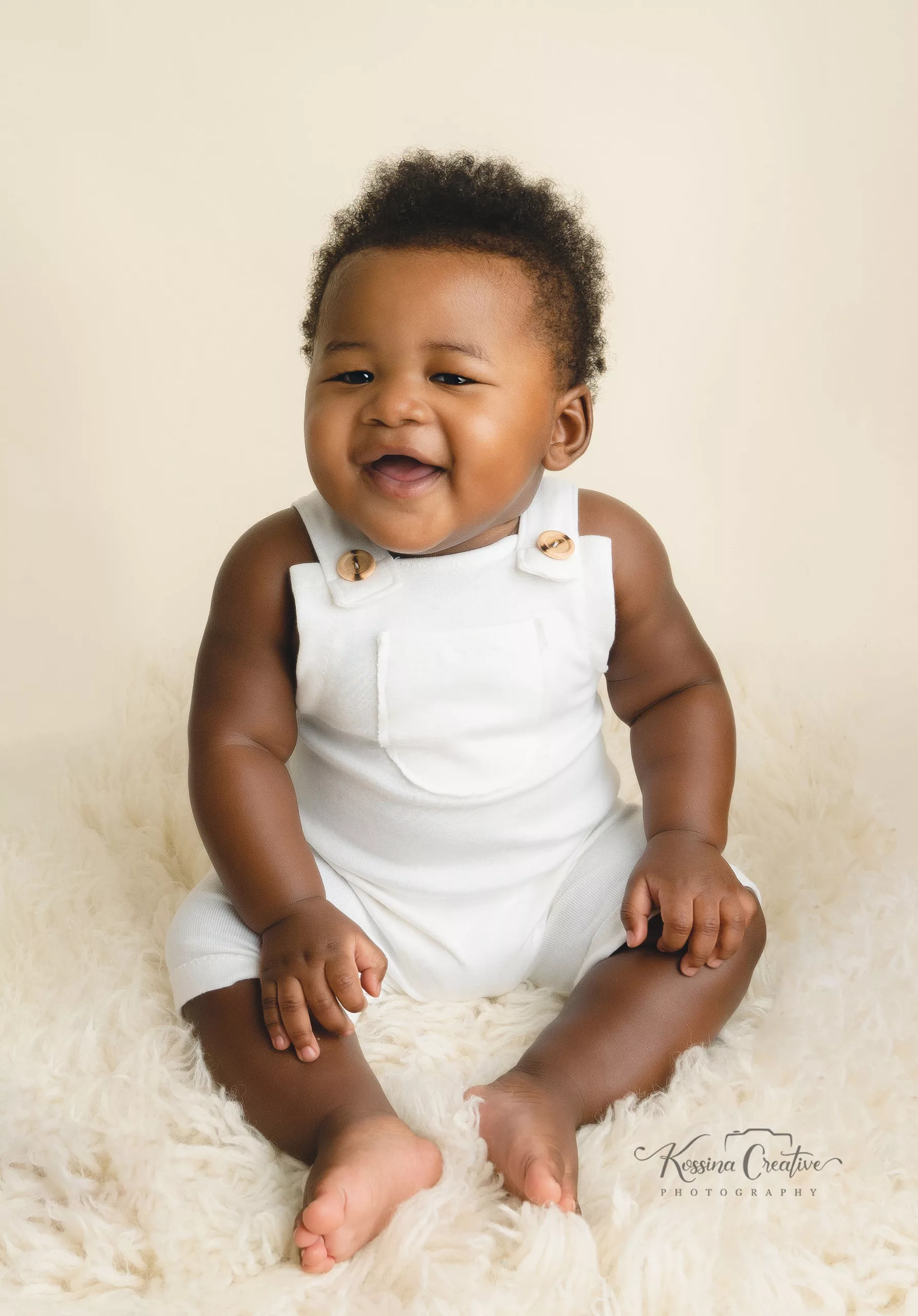 Orlando Baby Photographer 6 month sitter milestone baby boy white overalls on cream