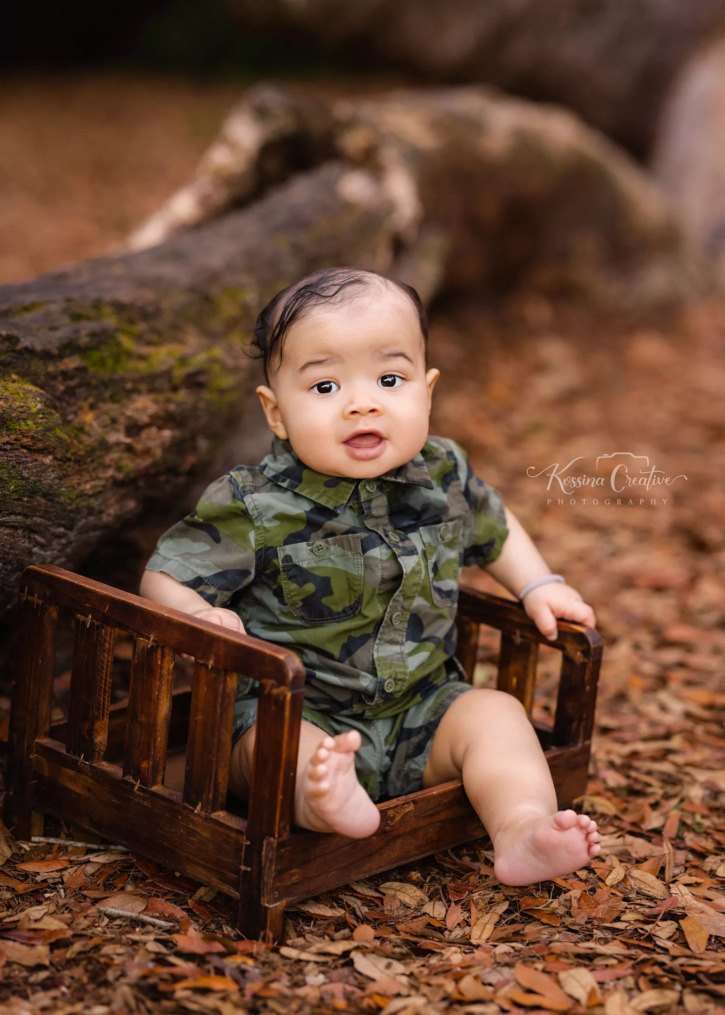 Orlando Baby Photographer 6 month sitter milestone baby boy outside wood bed