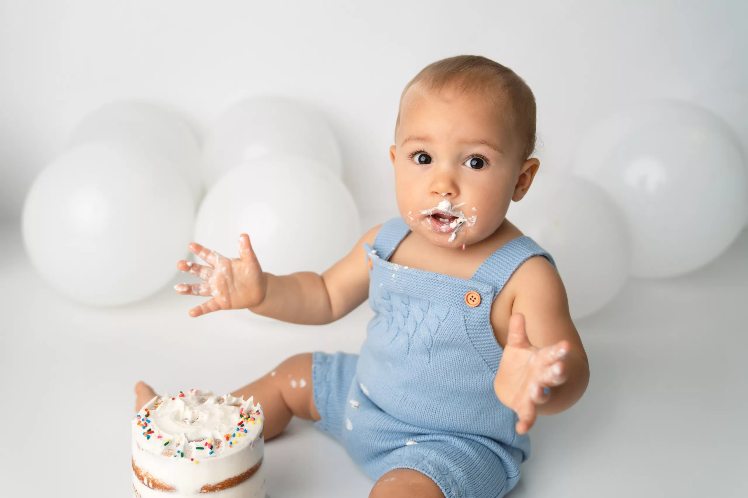 Orlando Boy Cake Smash 1st Birthday Photographer Photo Studio white balloons white cake jean overalls