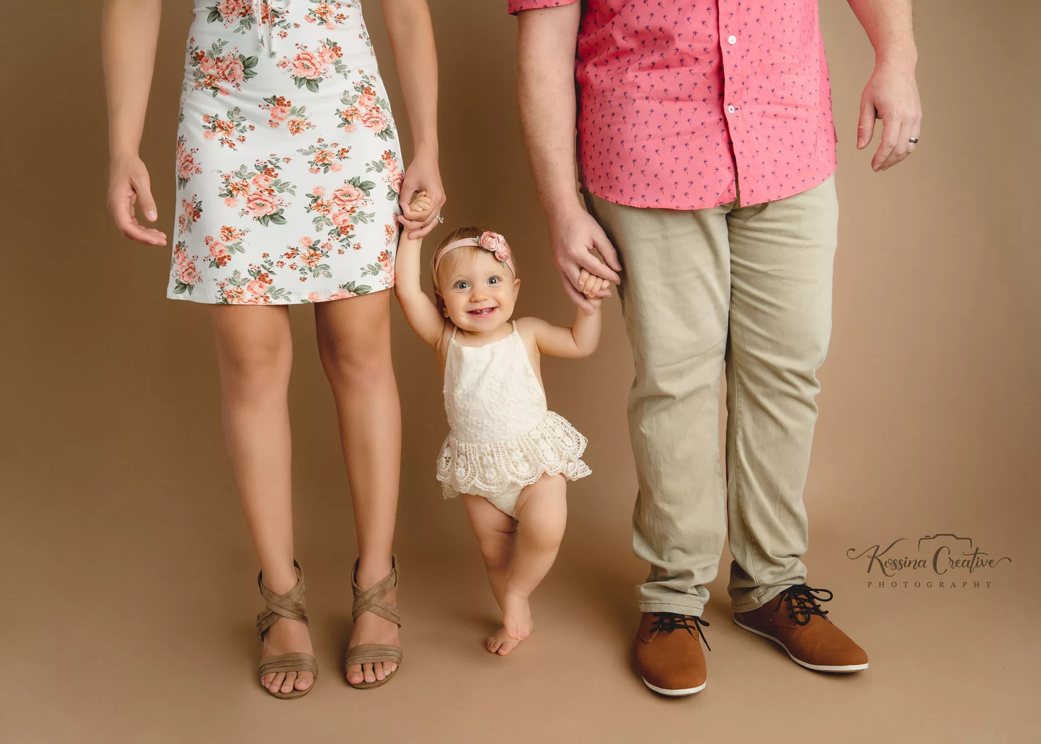 Orlando Family Cake Smash 1st Birthday Photographer Photo Studio holding hands with baby