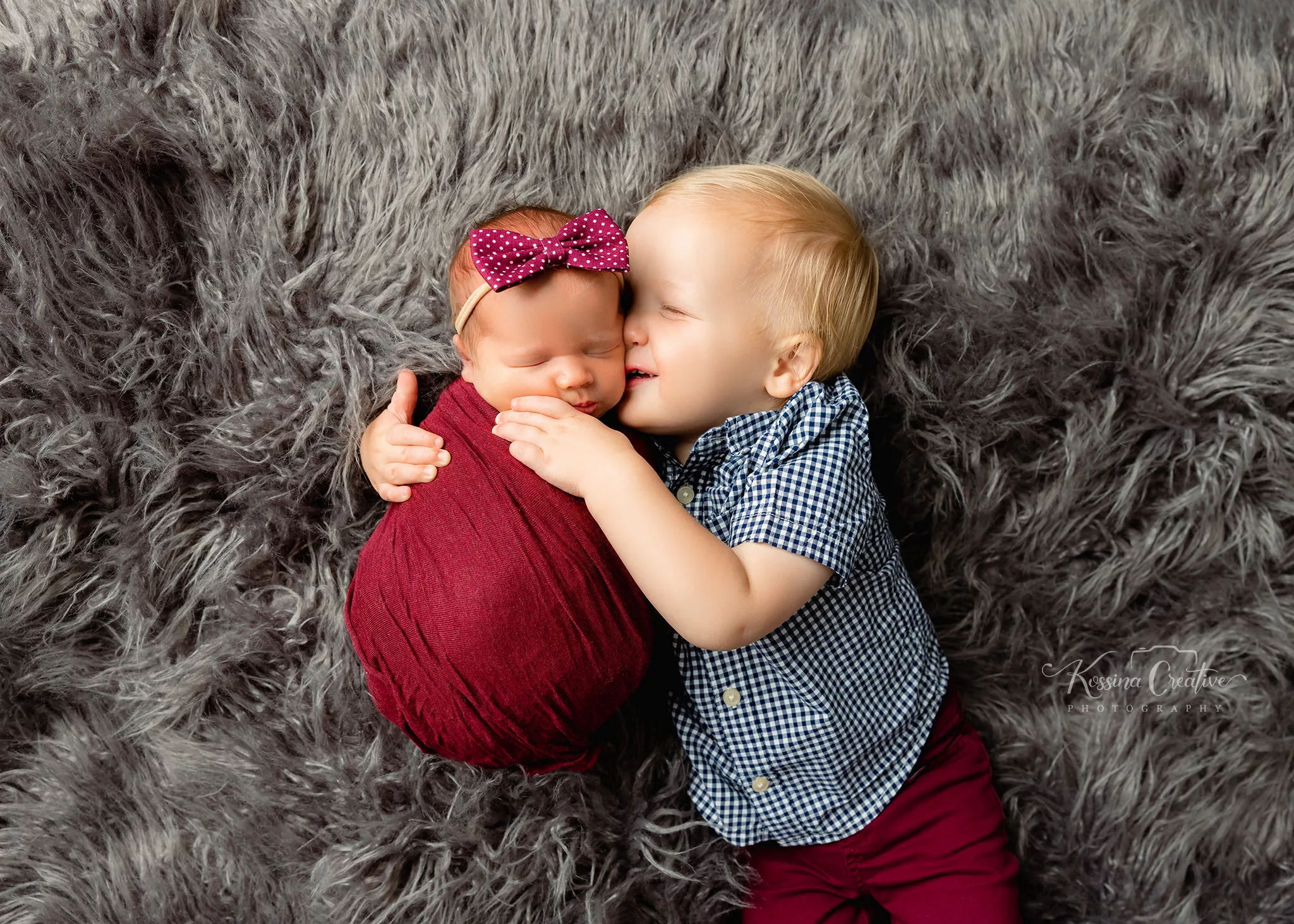 Orlando Family Newborn Photographer Baby Kid Photo studio sibling kisses big brother baby sister grey furred wrap