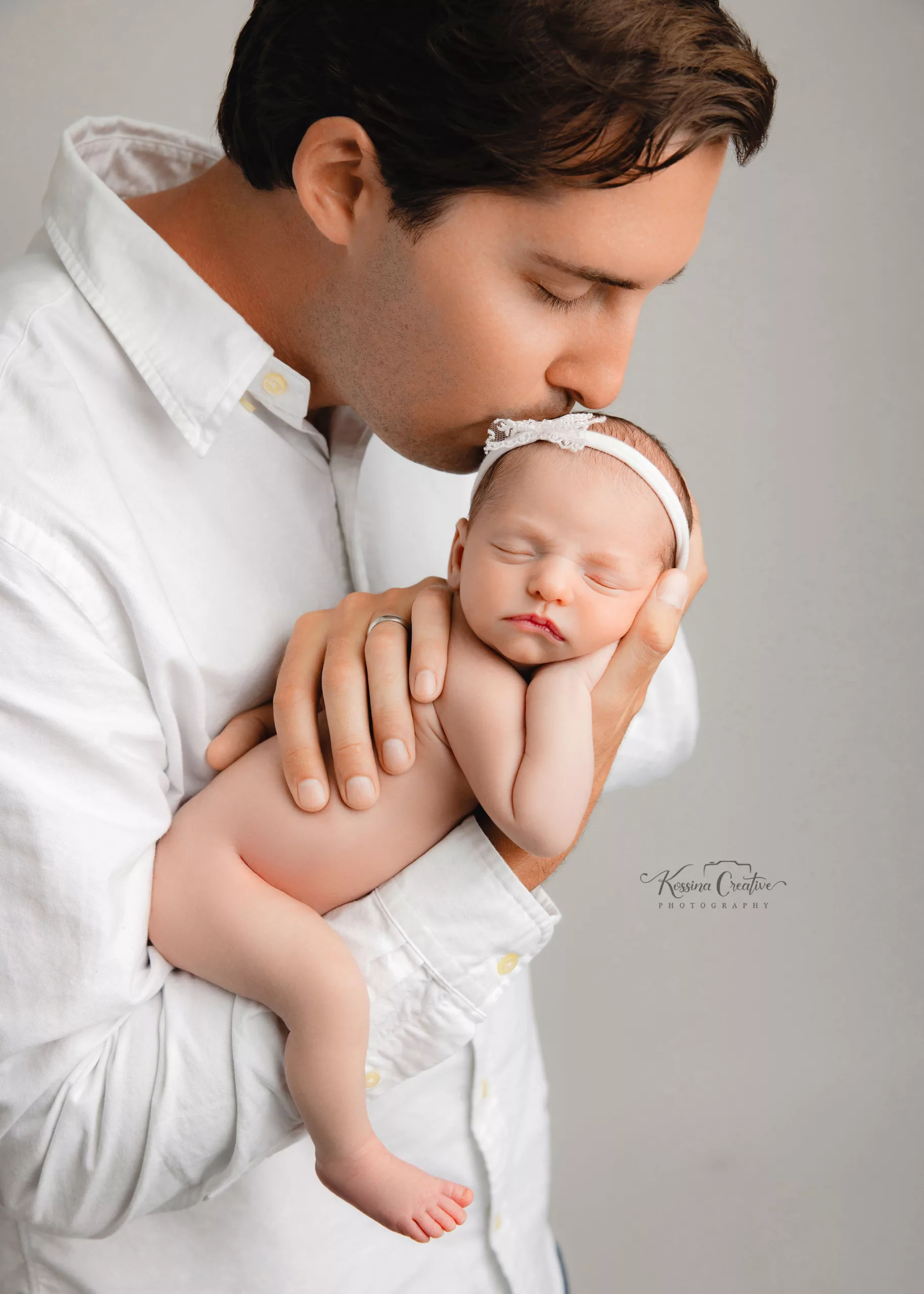 Orlando Family Newborn Photographer Baby Kid Photo studio daddy and me white on white baby girl sleeping daddy kisses