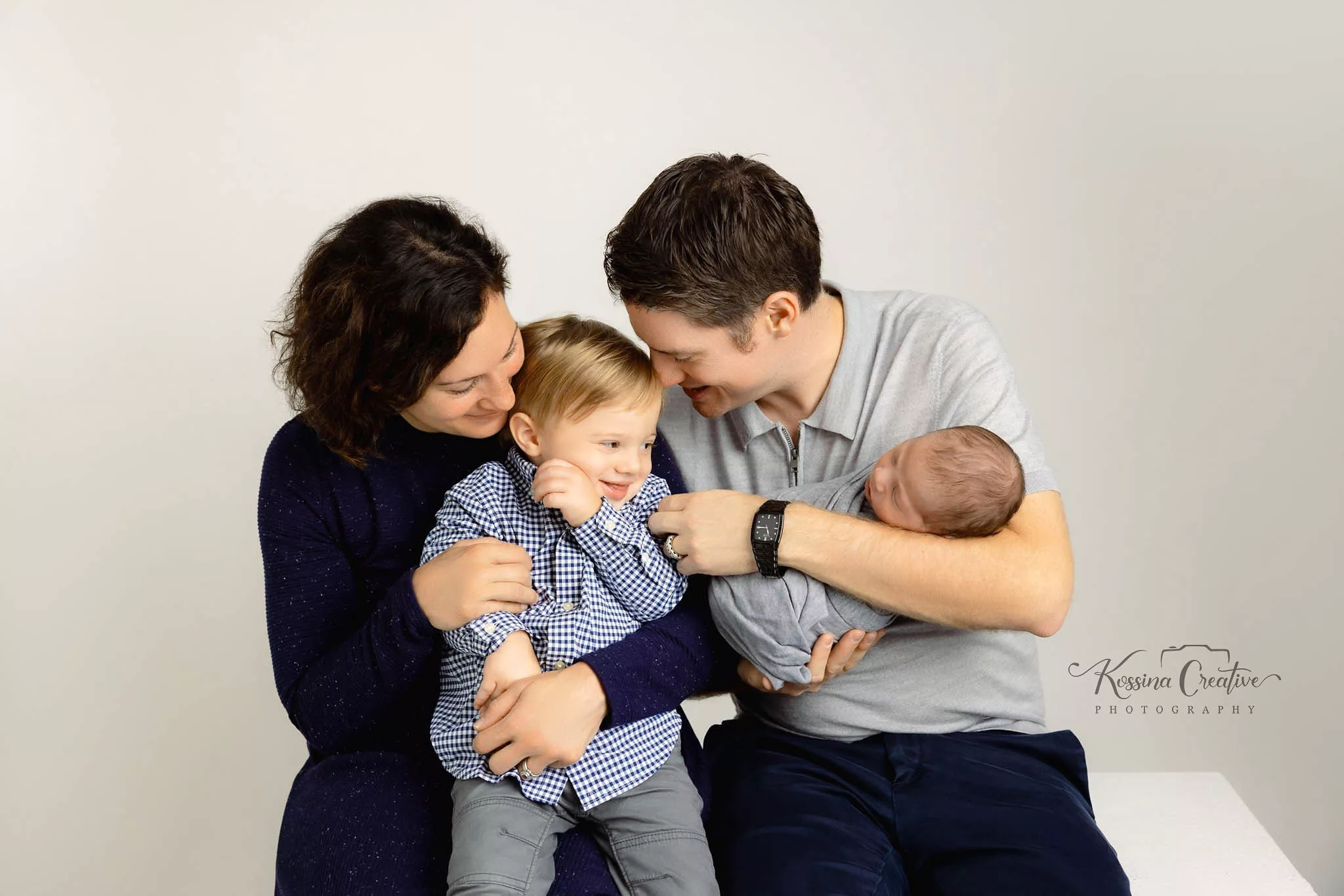 Orlando Family Newborn Photographer Baby Kid Photo studio candid family tickle fight brothers grey and navy blue