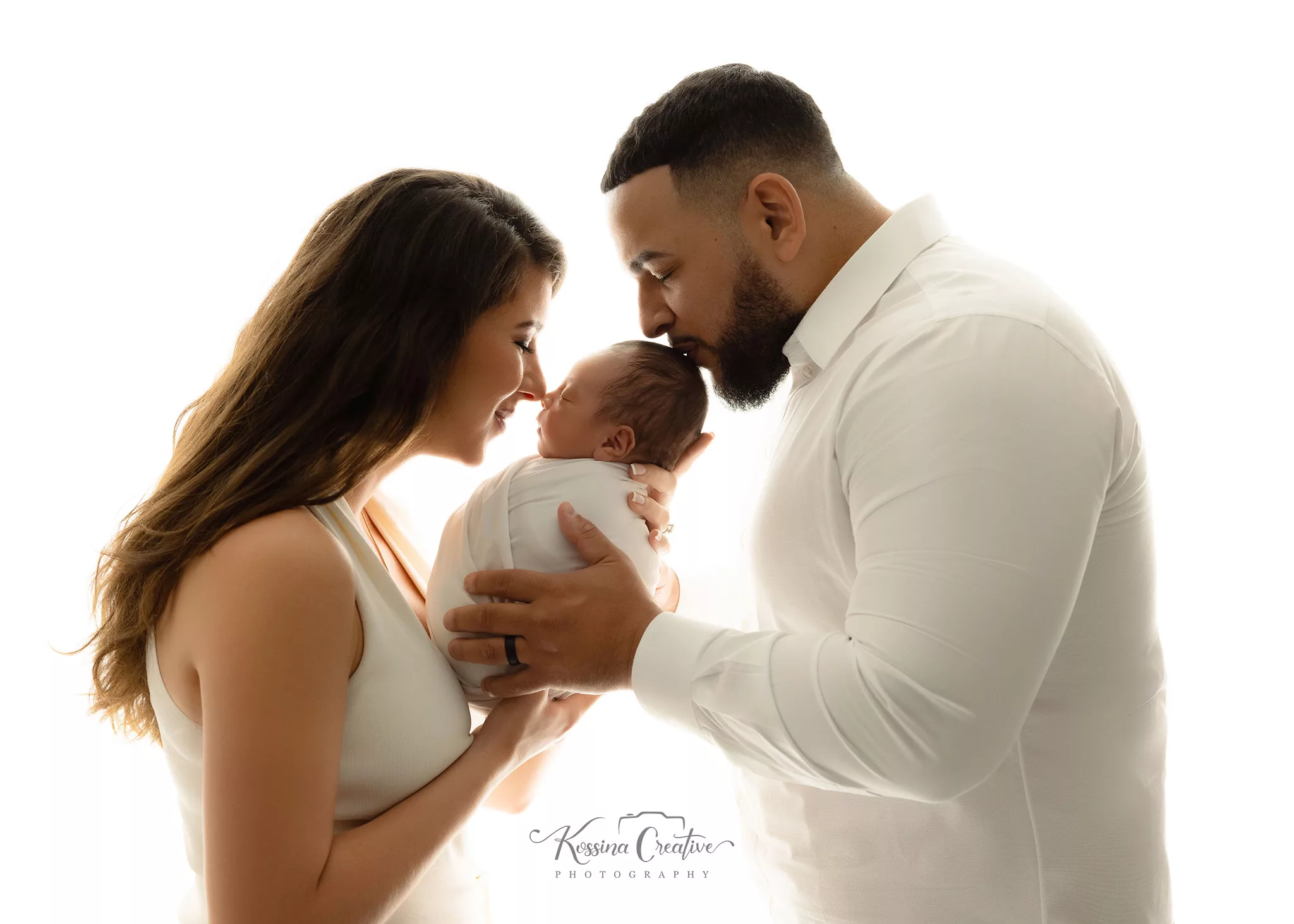 Orlando Family Newborn Photographer Baby Kid Photo studio silhouette mom dad baby kisses white back lit