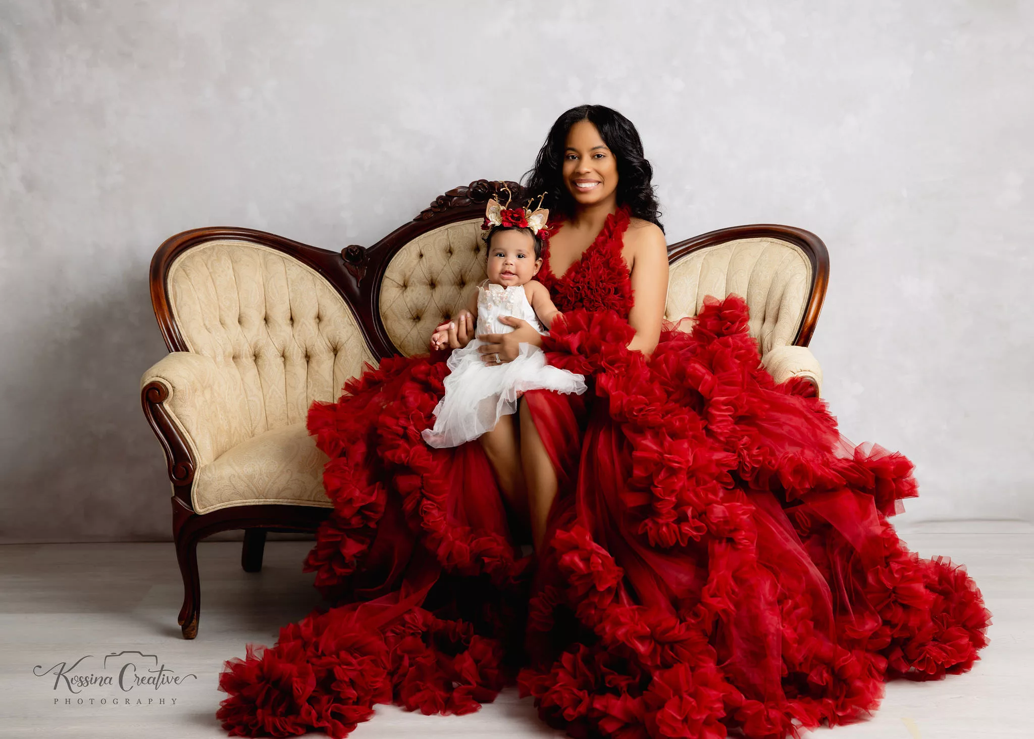 Orlando Family Photographer Motherhood Photo session mommy and me mini session mommy and baby girl on couch with red fluffy dress