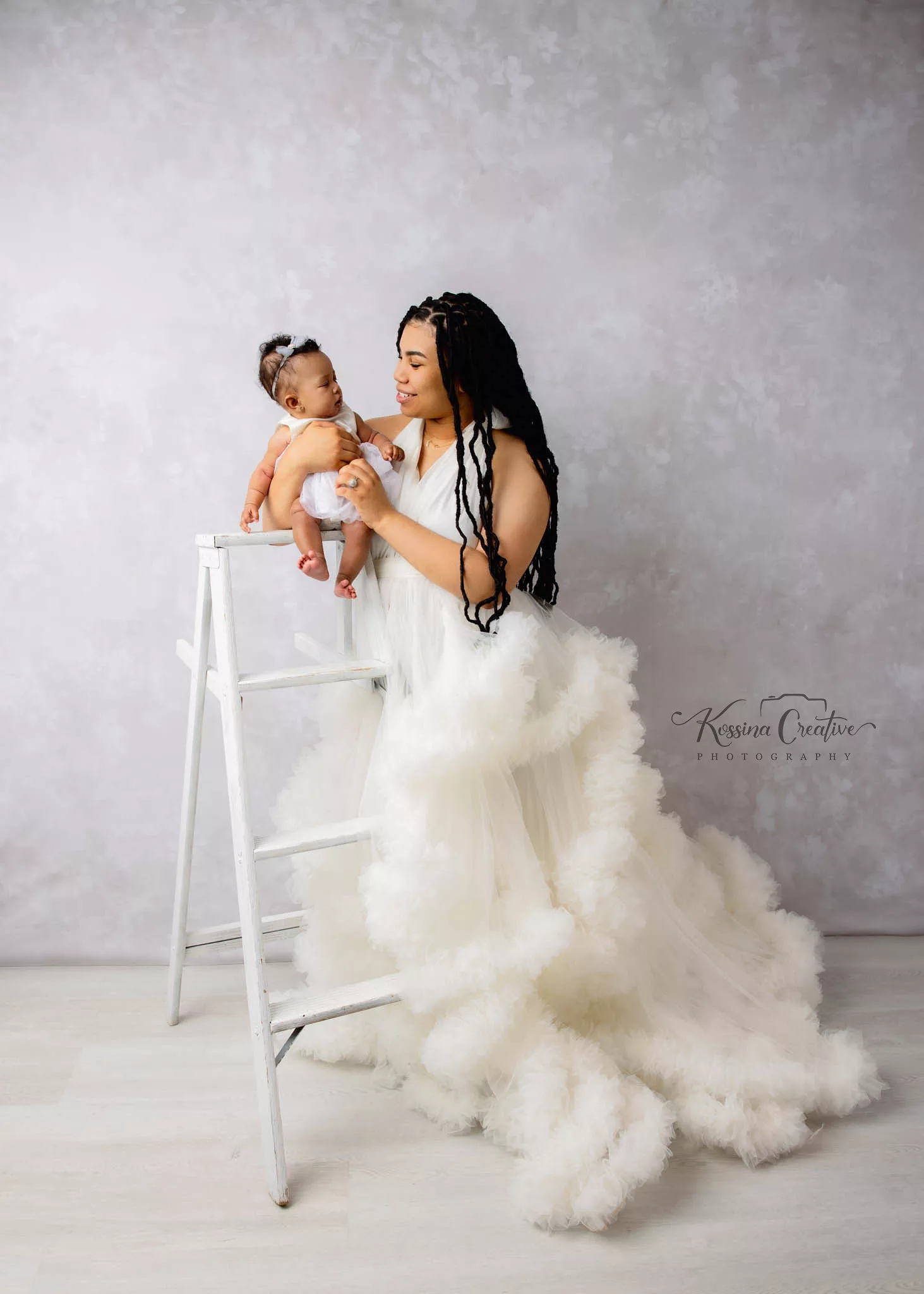 Orlando Family Photographer Motherhood Photo session mommy and me mini session mommy and babygirl white fluffy dress and white backdrop