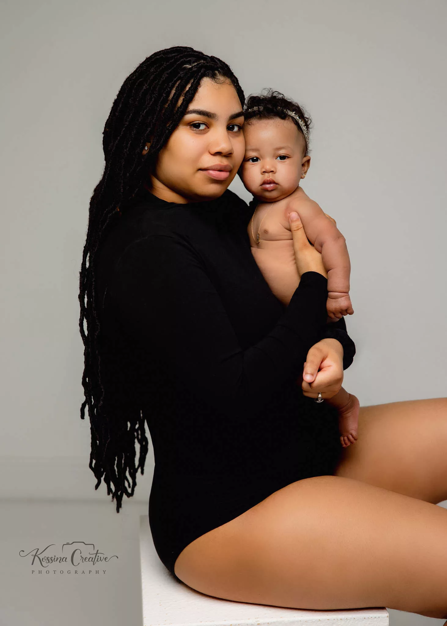 Orlando Family Photographer Motherhood Photo session mommy and me mini session mommy and babygirl with black leotards and grey backdrop