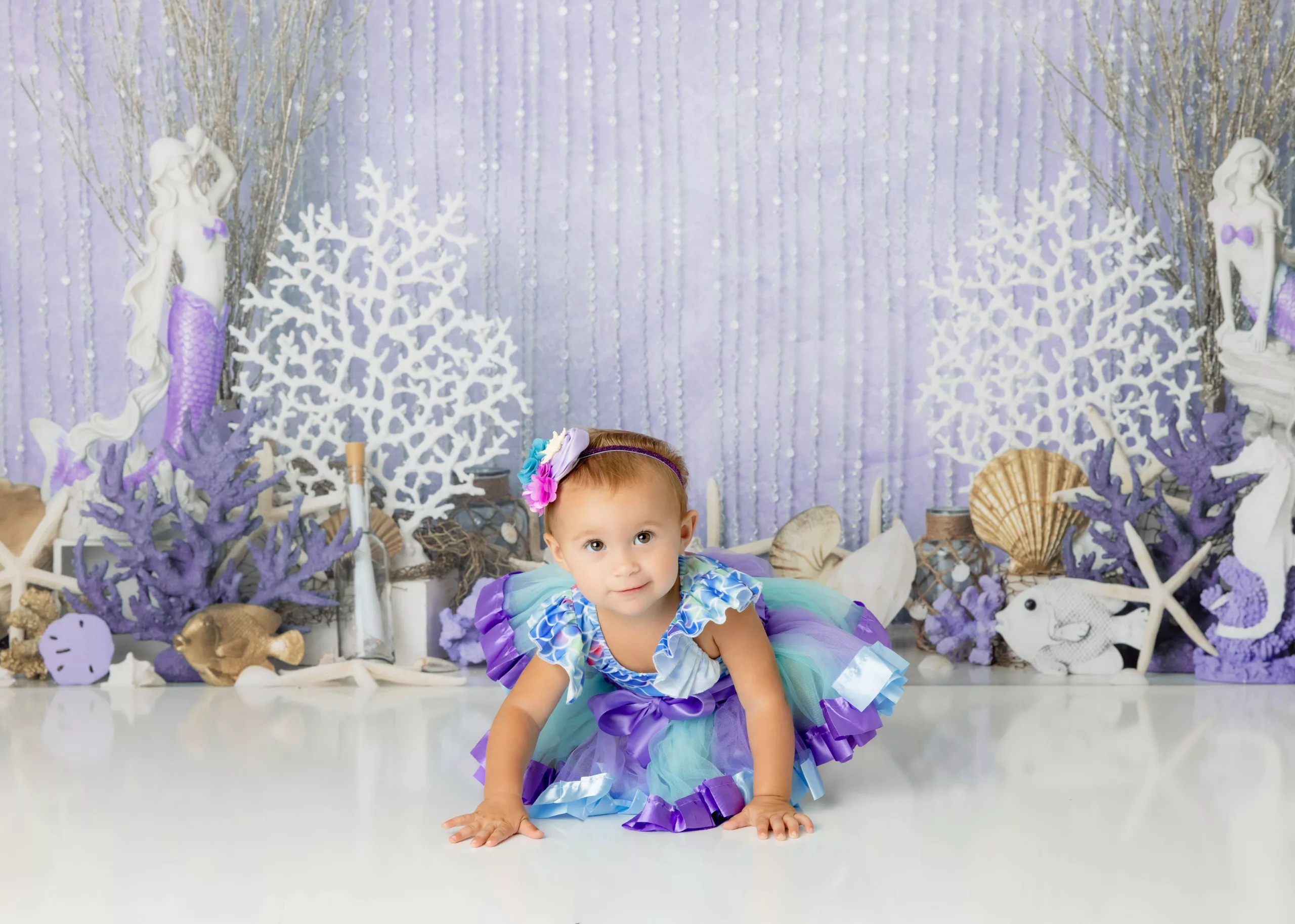Orlando Girl Cake Smash 1st Birthday Photographer Photo Studio mermaid purple teal gold shells underwater feel