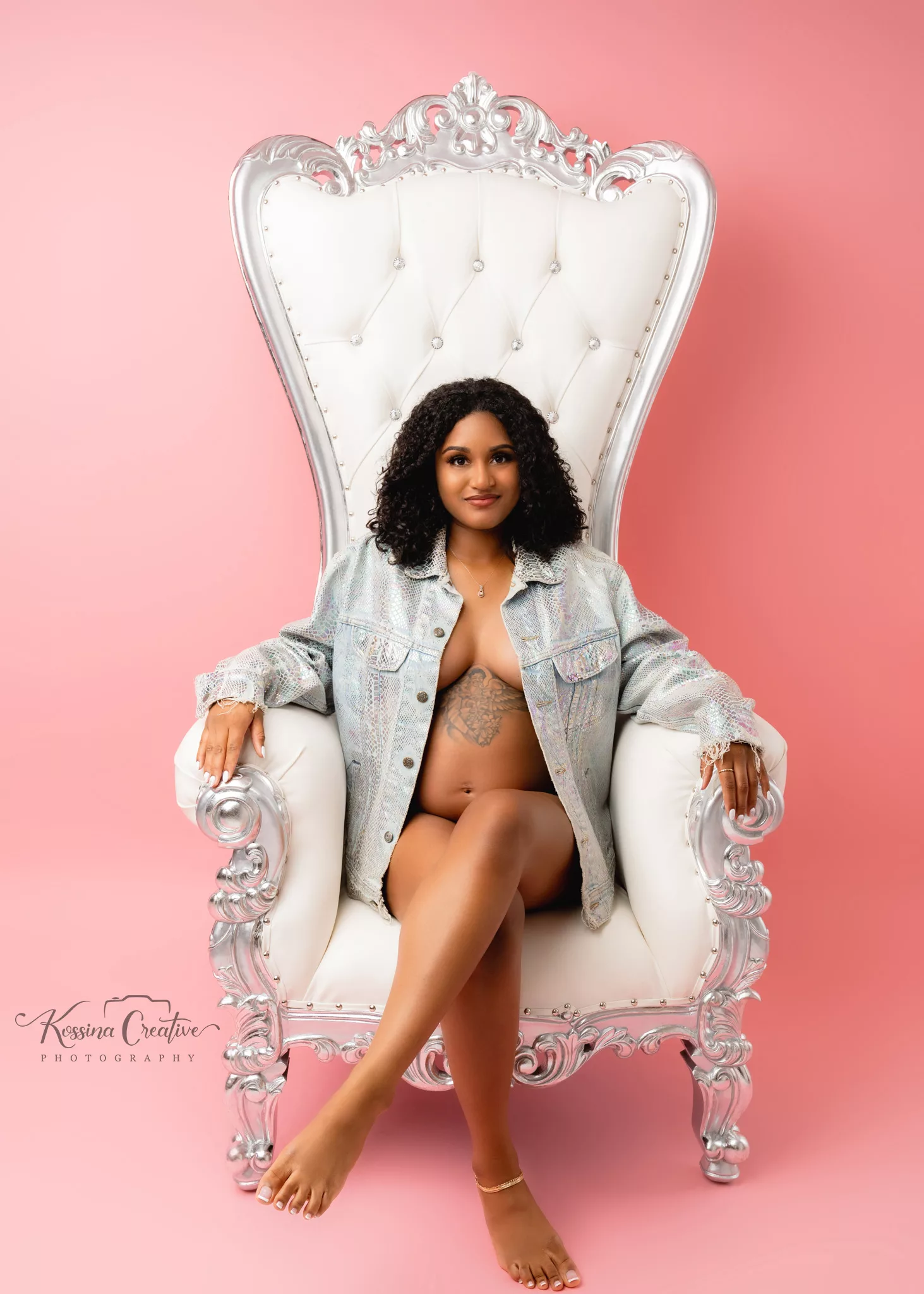 Orlando Maternity Boudoir Photographer Photo Studio Glamour shots pink background jean jacket queen thrown