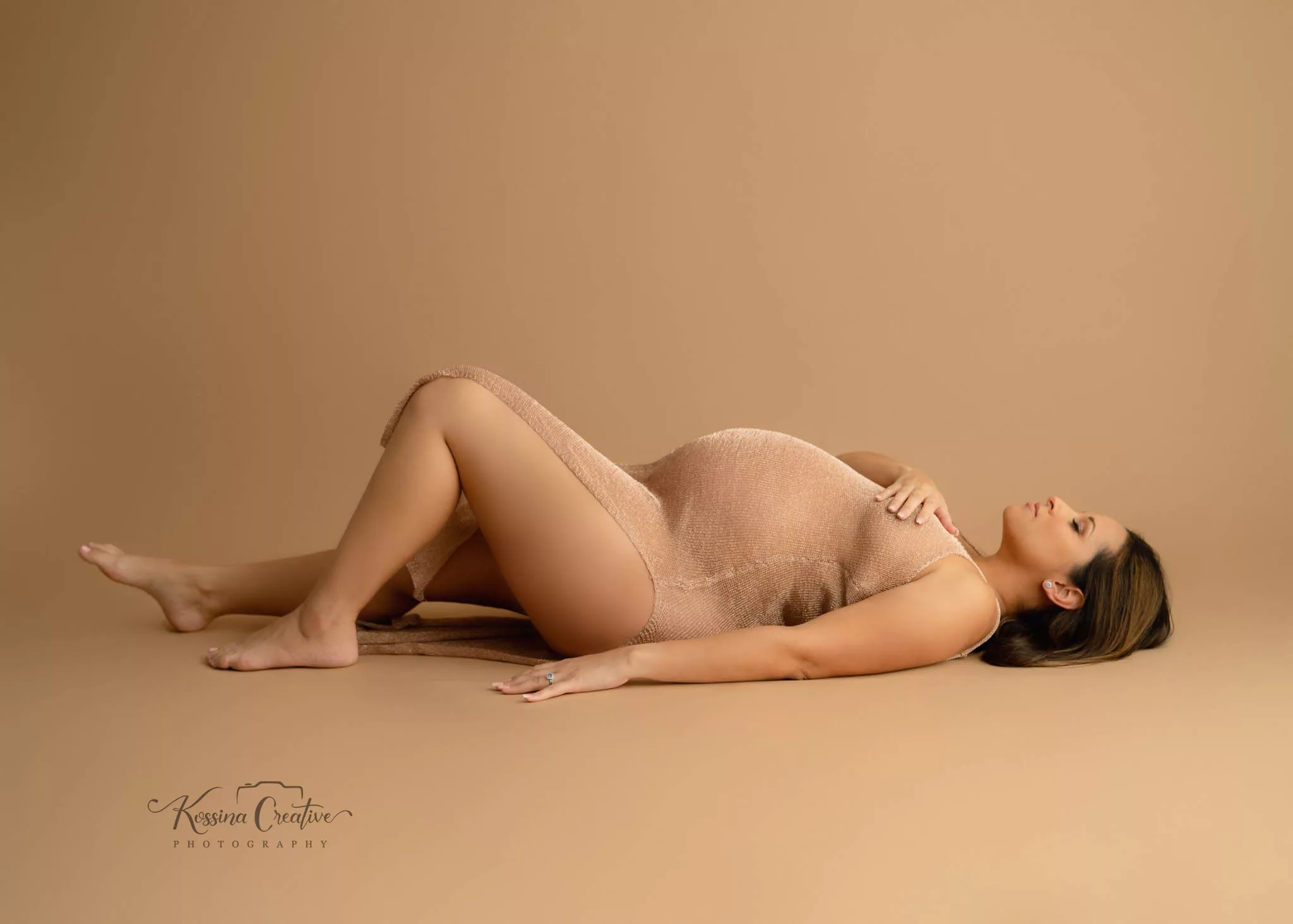 Orlando Maternity Boudoir Photographer Photo Studio Glamour shots laying down brown dress