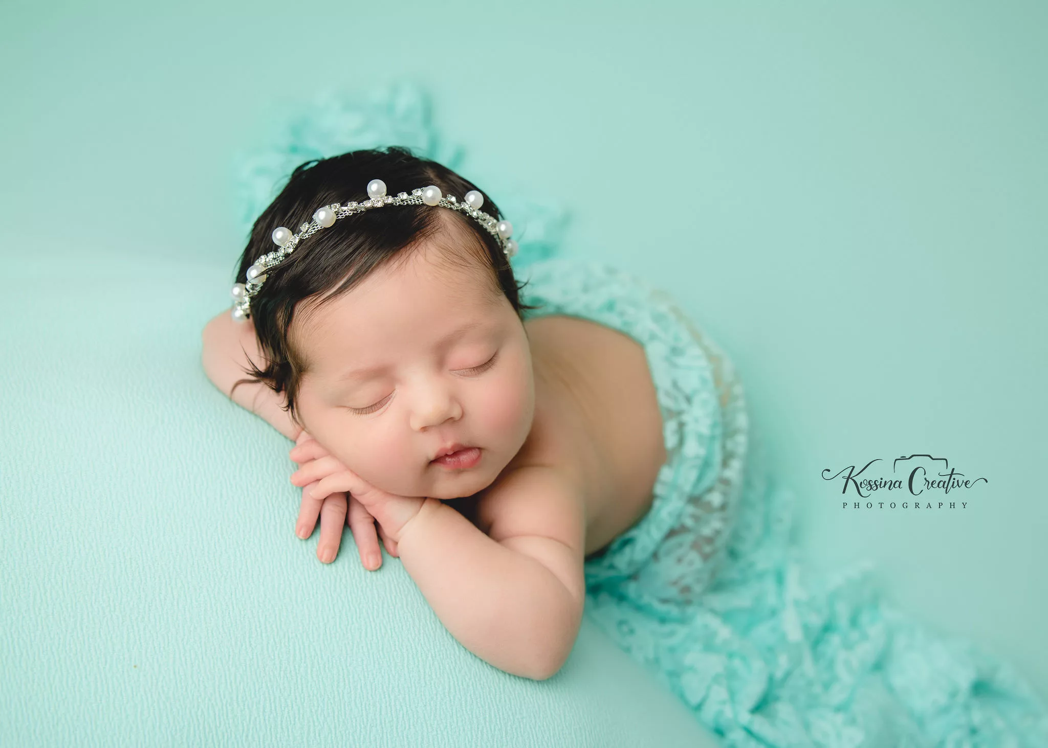 Orlando Newborn Photographer Baby Girl Photo studio sleeping teal on teal pearl headband