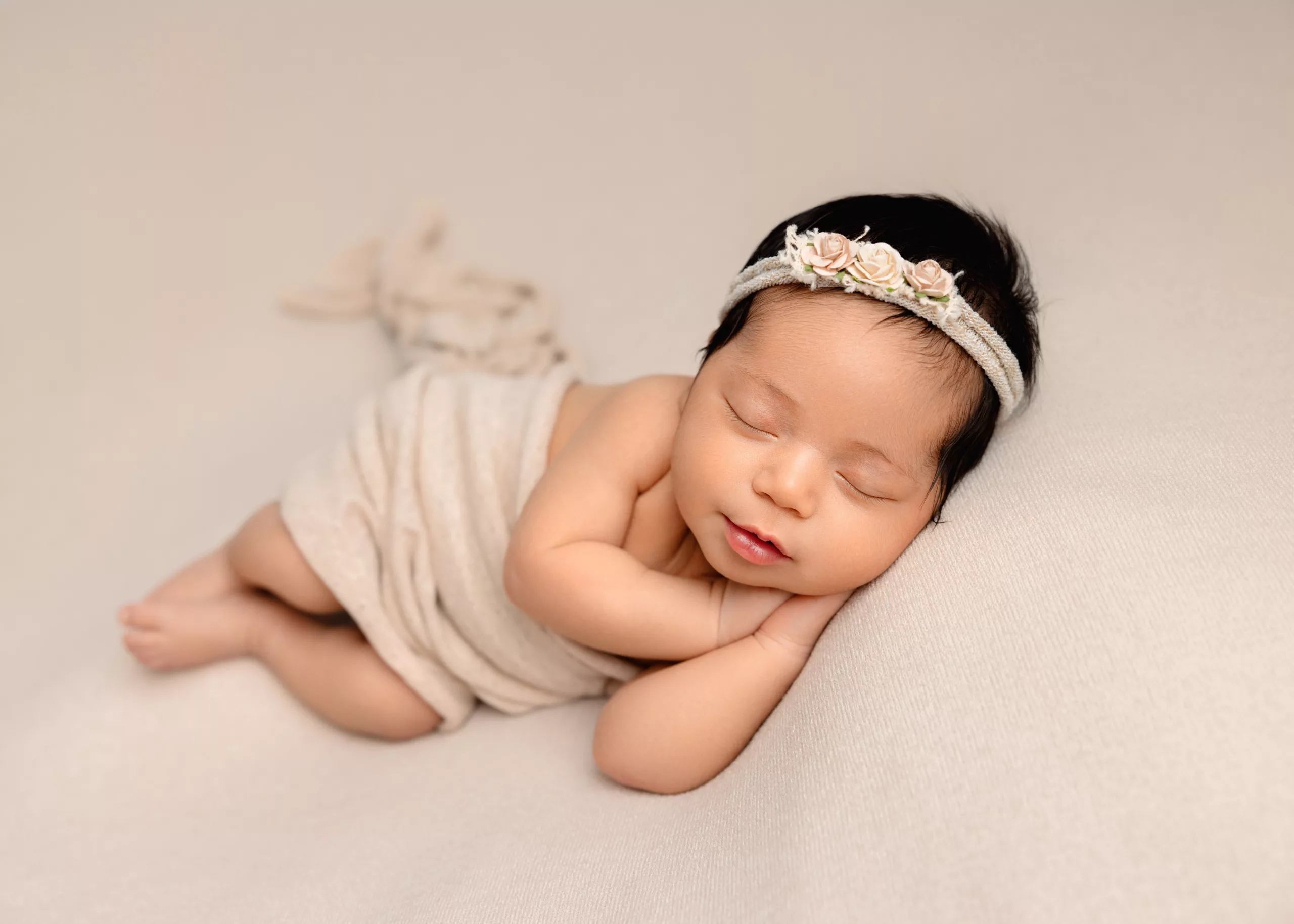Orlando Newborn Photographer Baby Girl Photo studio sleeping cream on cream baby with boho head band
