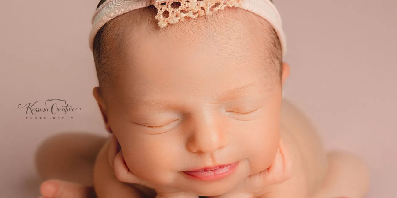 Orlando Newborn Photographer Baby Girl Photo studio froggy pose pink with bow