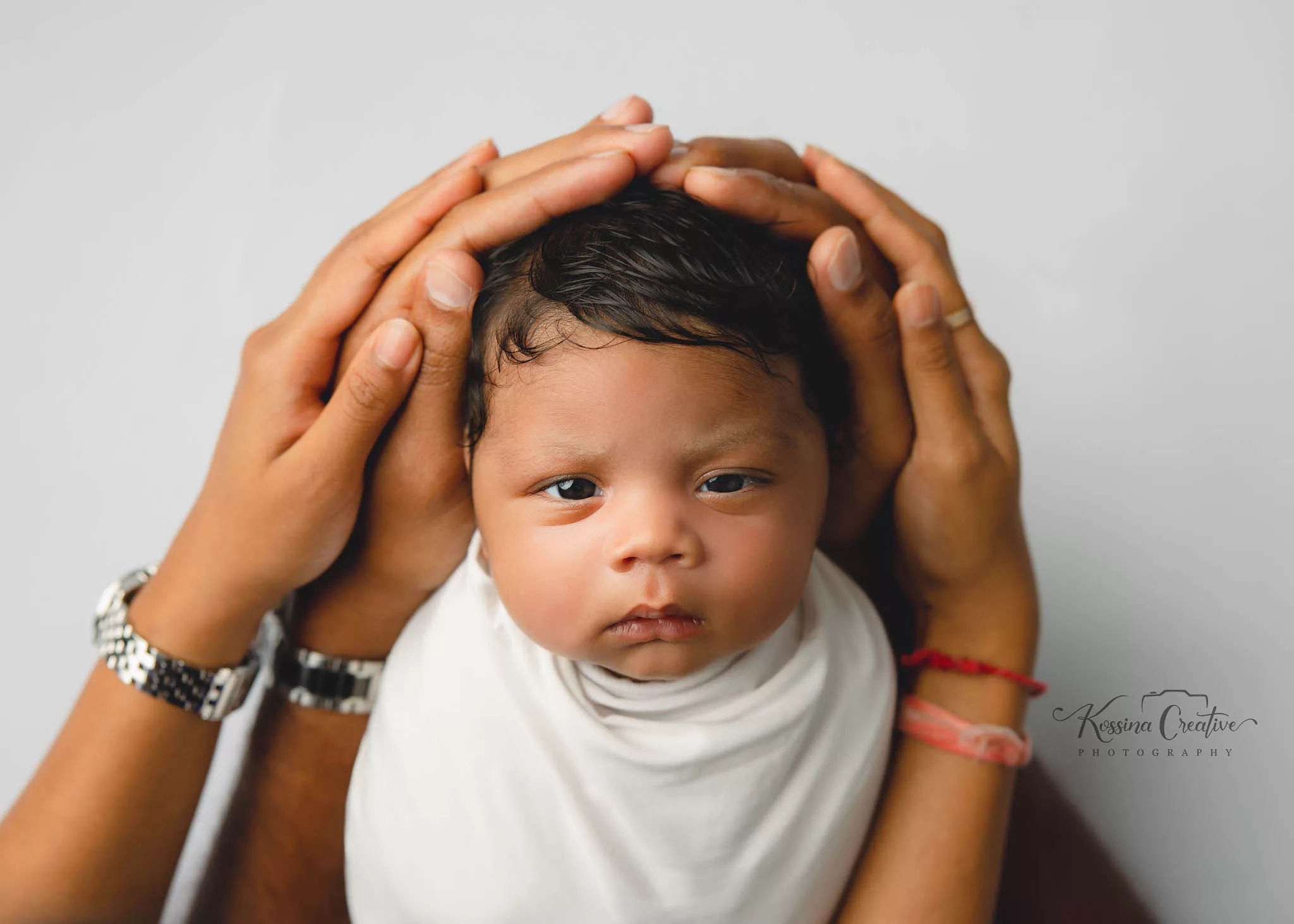 Orlando Newborn Photographer Photo Studio Baby Boy baby in hands