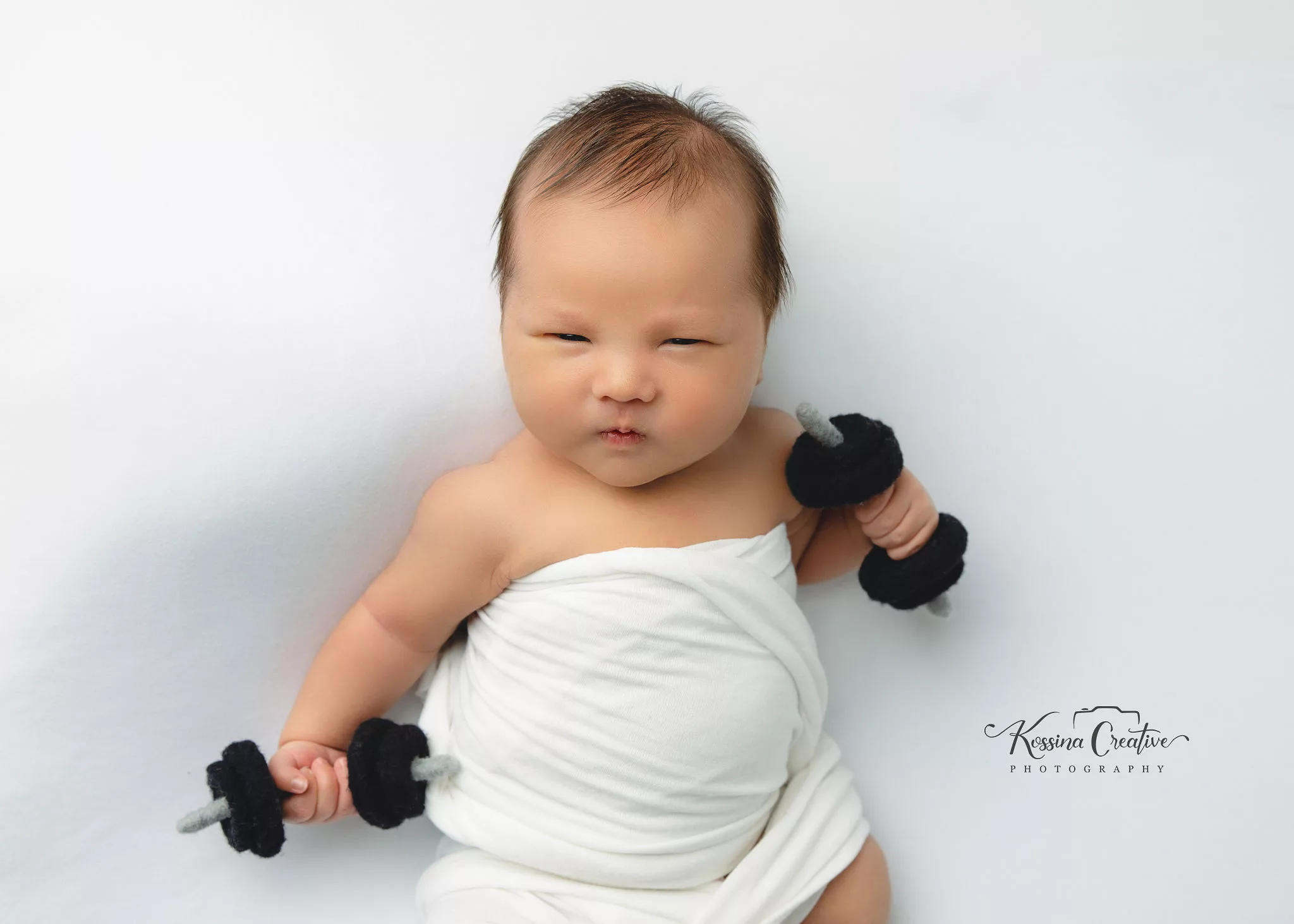 Orlando new born photography baby photo studio baby lifting weights