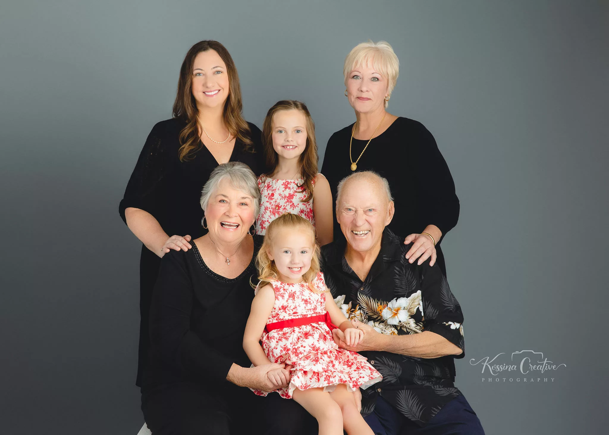 orlando photo studio family photographer studio portraits generations grey background black outfits grandparents matching kid dresses